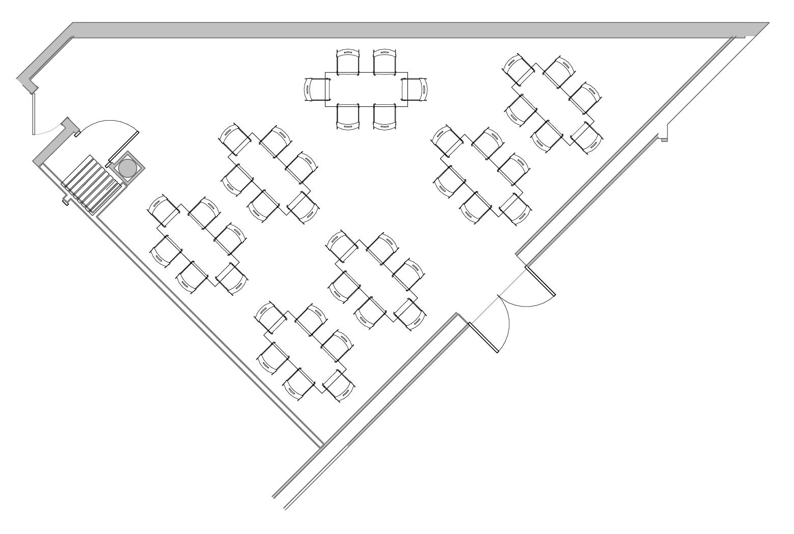 A triangluar shaped room with seven rectangular tables.