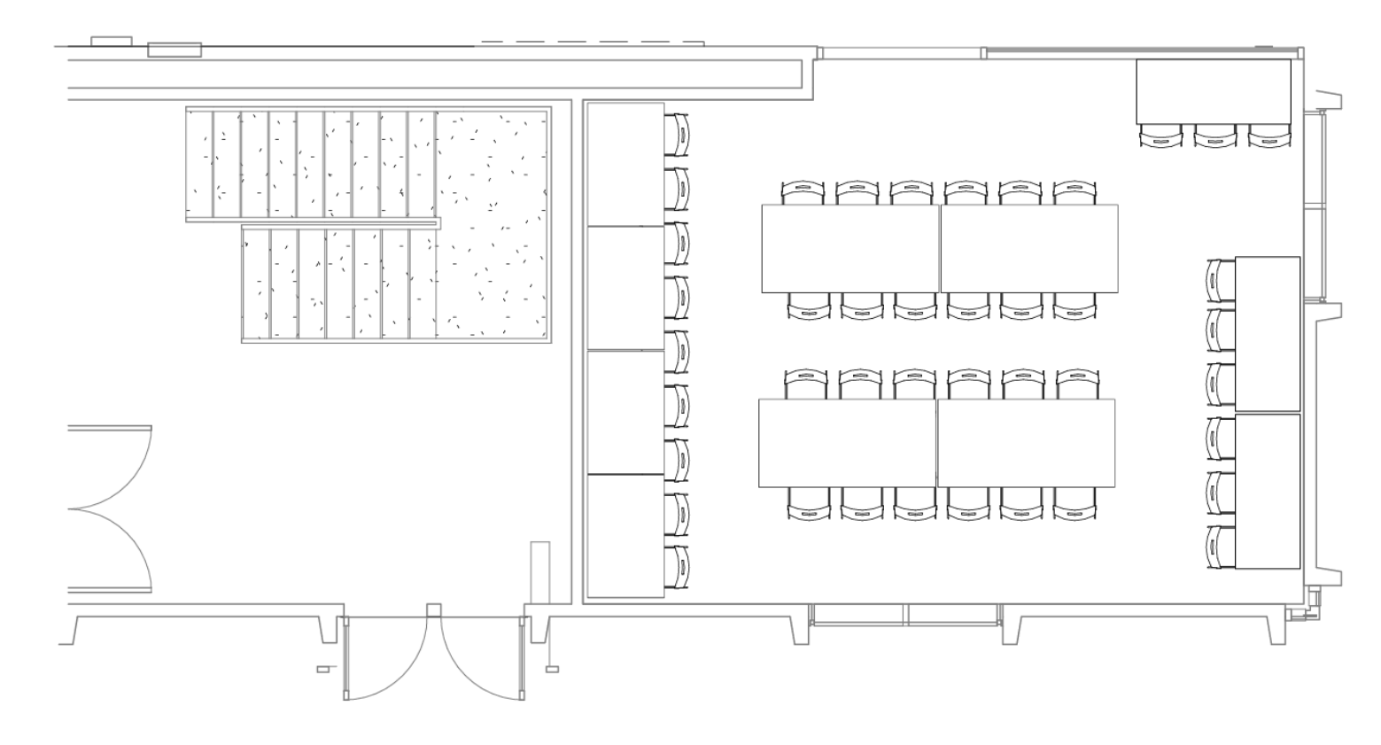 Rectangular room with eleven rectangular tables.