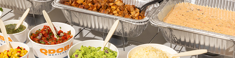 catering food displayed in take out containers